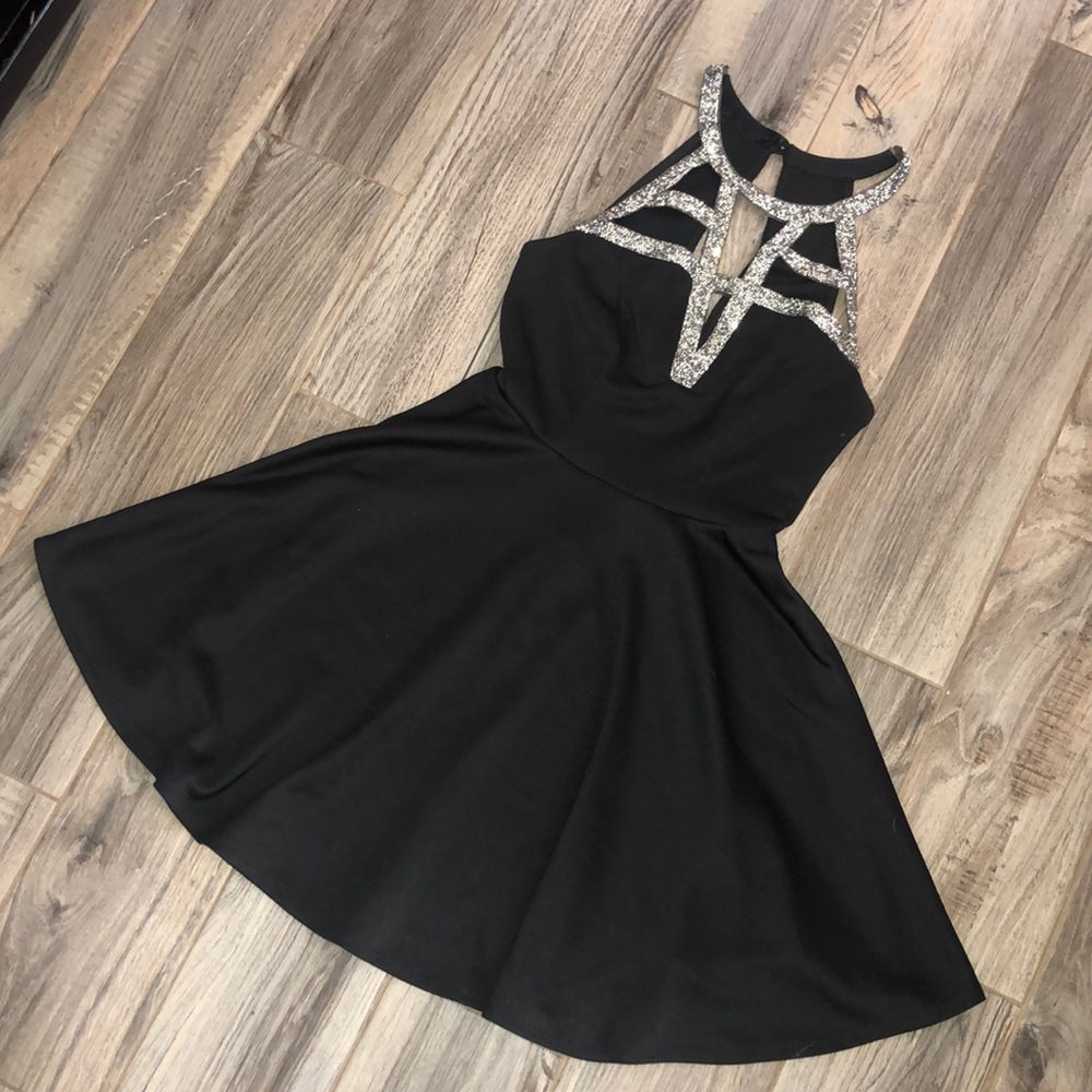 Black diamond encrusted cocktail dress.